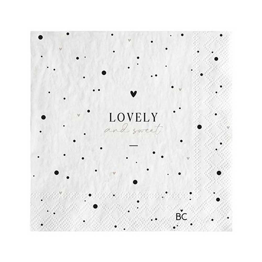 Eine weiße Serviette mit schwarzen Punkten und dem Wort „Lovely“. Diese Bastion Collections - Papierservietten Lovely and Sweet 20 Stück sind eine schöne Ergänzung für jede Tischdekoration, perfekt für Veranstaltungen oder den täglichen Gebrauch.