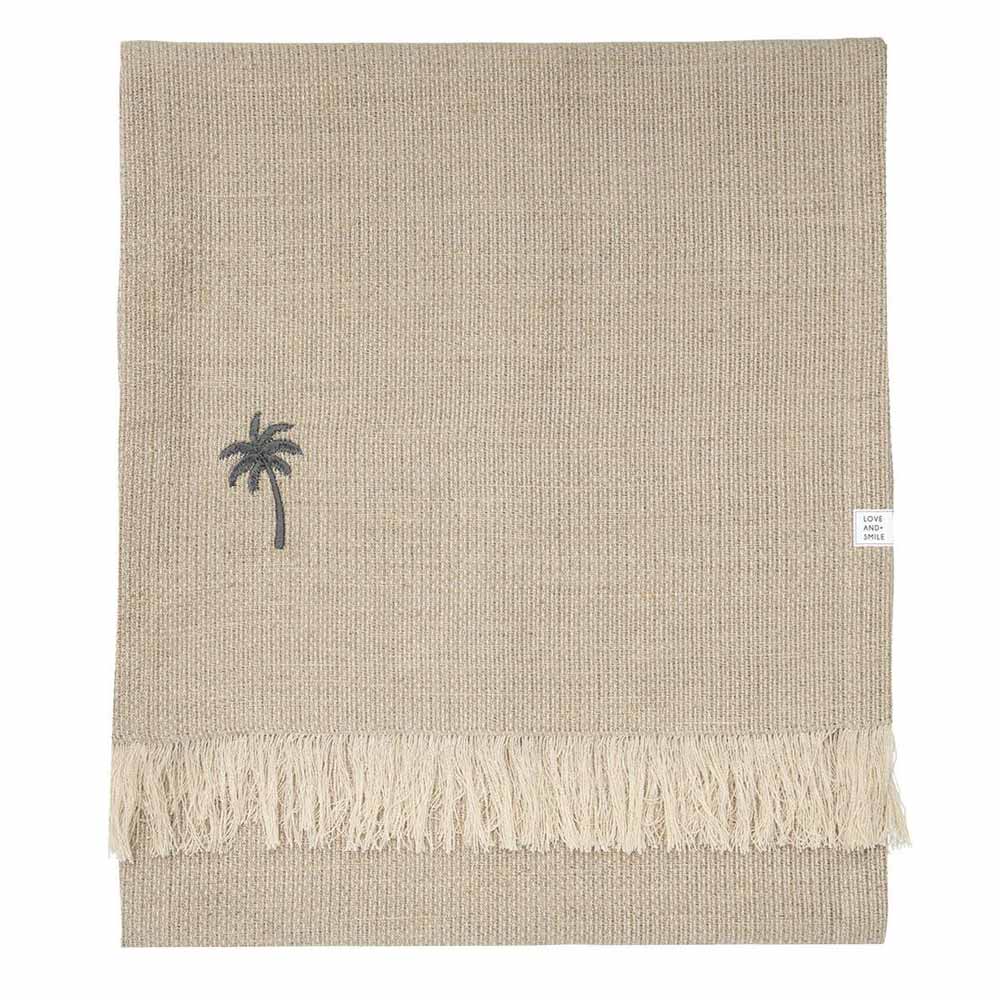 Beiger Tischläufer aus Leinen von Bastion Collections mit den Maßen 160 x 38 cm mit Fransenkanten und einer kleinen gestickten Palme.