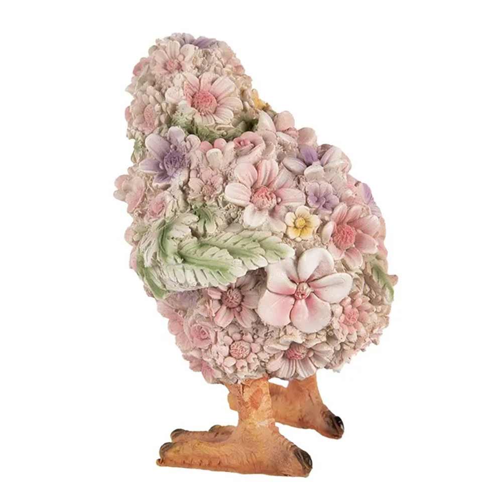 Eine Clayre & Eef – Küken Deko Blume bedeckt mit detaillierten pastellfarbenen Blüten und Blättern, mit sichtbaren orangefarbenen Beinen und Füßen.