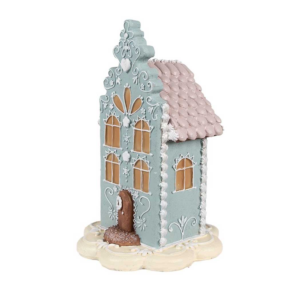 Das Clayre & Eef - Lebkuchenhaus 20 cm Blau Rosa ist ein dekoratives Lebkuchenhaus mit aufwendigen Mustern, pastellblauen und rosa Details und einem bezaubernden gewellten Dach.