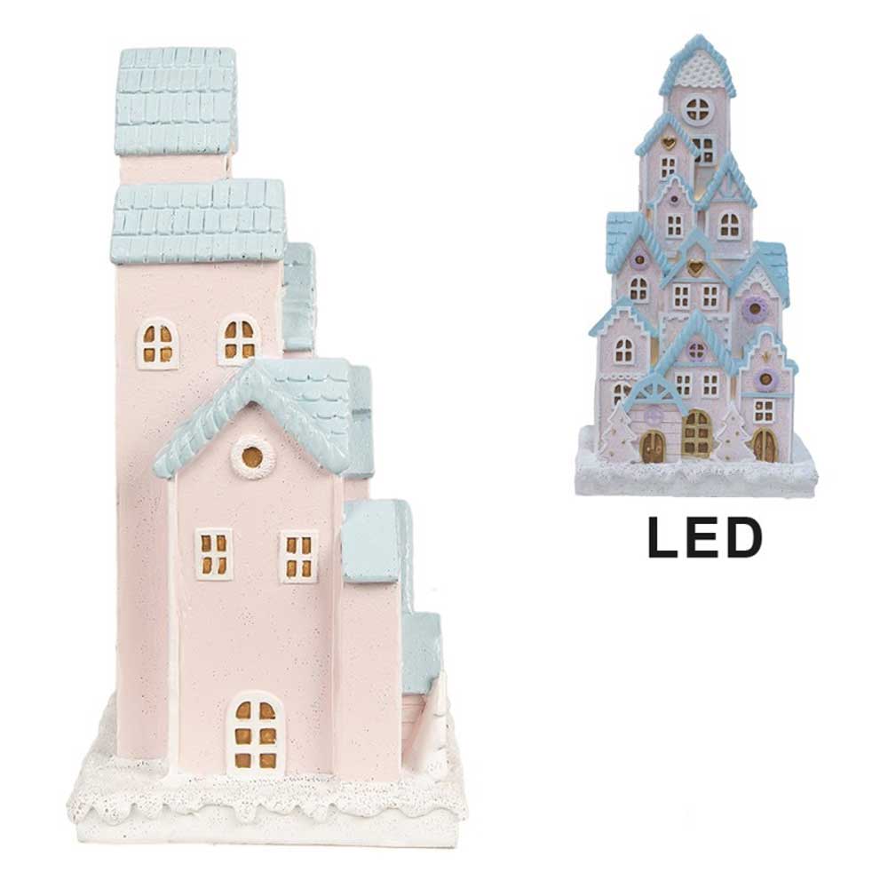 Zwei rosa Miniatur-Dorfhäuser mit blauen Dächern, eines höher und kunstvoller, mit der Aufschrift „Clayre & Eef – Lebkuchenhaus Schloss mit LED 26 cm“.