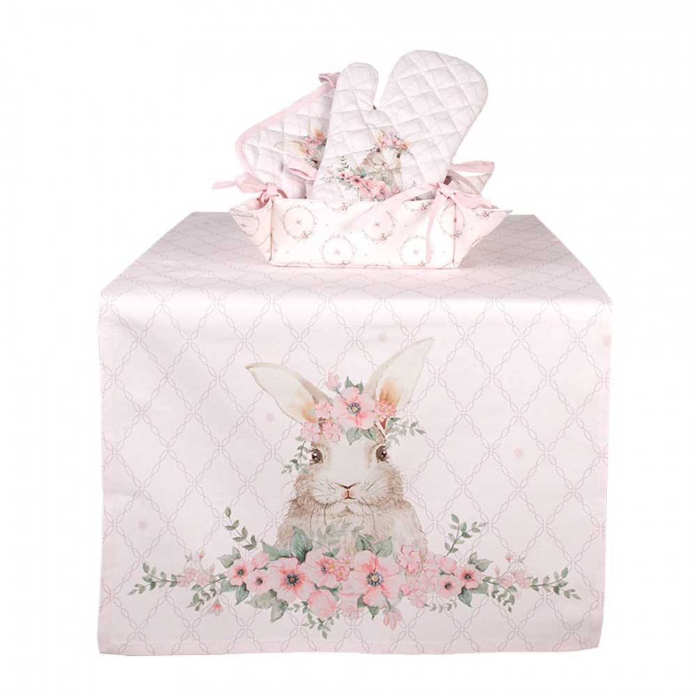 Ein Tisch mit einer rosa Tischdecke und Clayre & Eef – Ofenhandschuh Hase Rosa.