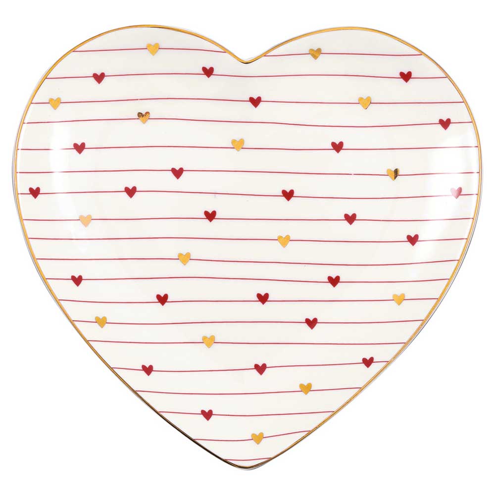 Ein herzförmiger GreenGate - Grace Herz Teller in Weiß mit roten und goldenen Herzen und horizontalen roten Linien.