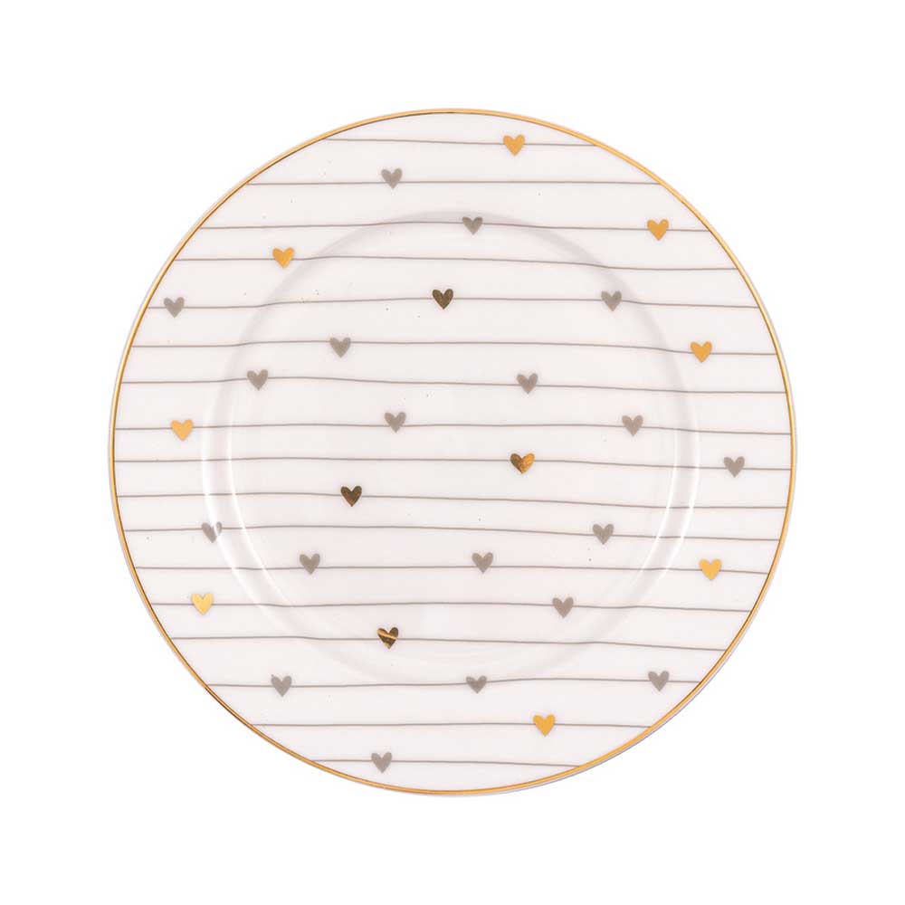Ein GreenGate - Grace Keksteller mit goldenen und silbernen Herzen und gleichmäßig verteilten goldenen Linien, die ein Muster auf der Oberfläche bilden. Der Rand des Kekstellers ist mit Gold ausgekleidet.