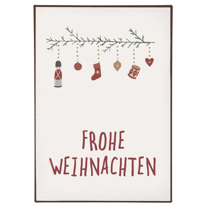 Schild mit Weihnachtsdekorationen, die an einem Zweig hängen, und dem Text „Ib Laursen – Metallschild Frohe Weihnachten“ darunter.