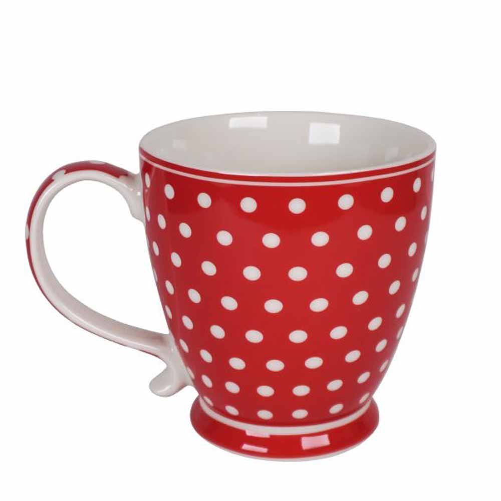 Isabelle Rose - Tasse Keramik mit Punkten Rot, mit weißer Innenseite, vor einem schlichten Hintergrund.