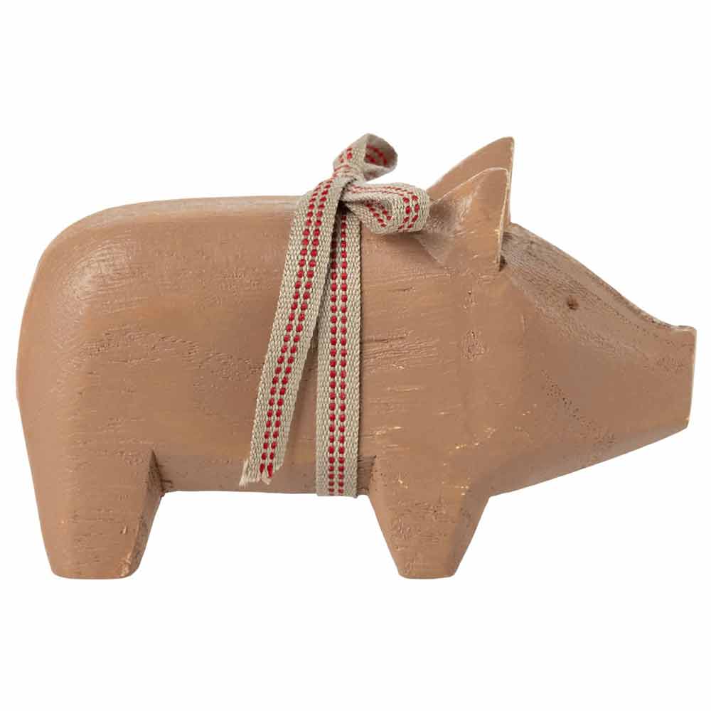 Maileg wooden pig with ribbon - a charming handmade artwork, perfect for holiday decoration or as a meaningful gift for the new year.