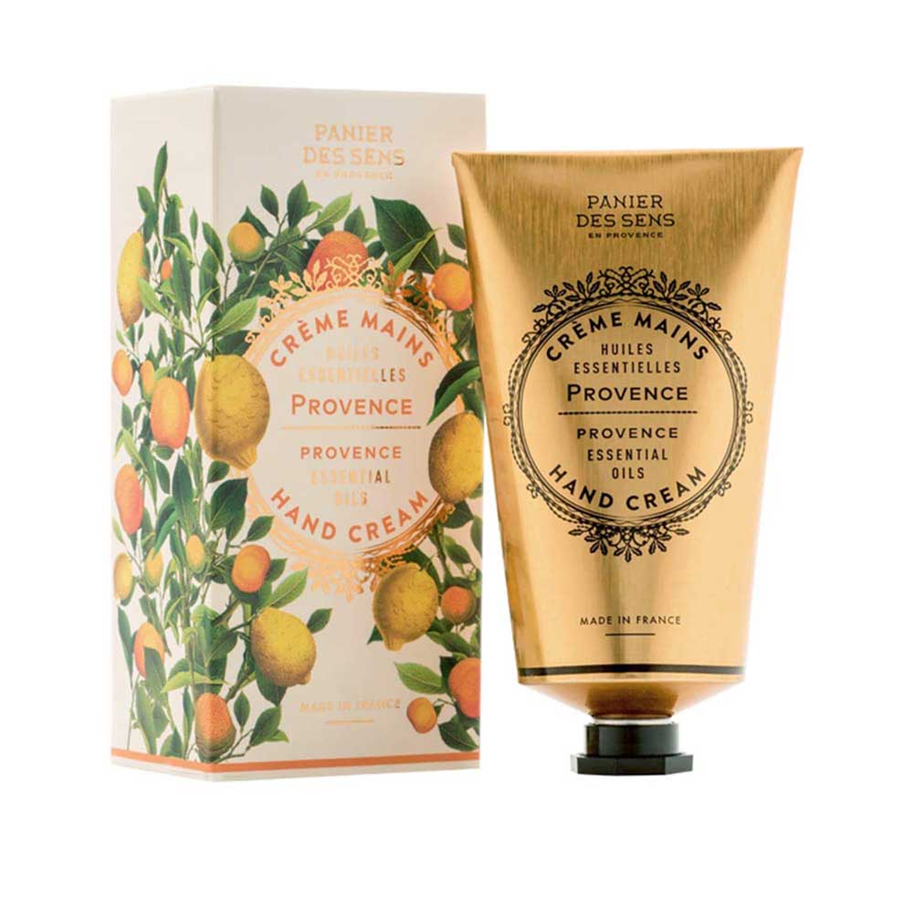 Eine Tube Handcreme mit einer Verpackung mit Zitrusfruchtmotiven und der Aufschrift „Panier des Sens – Handcreme Provence“.