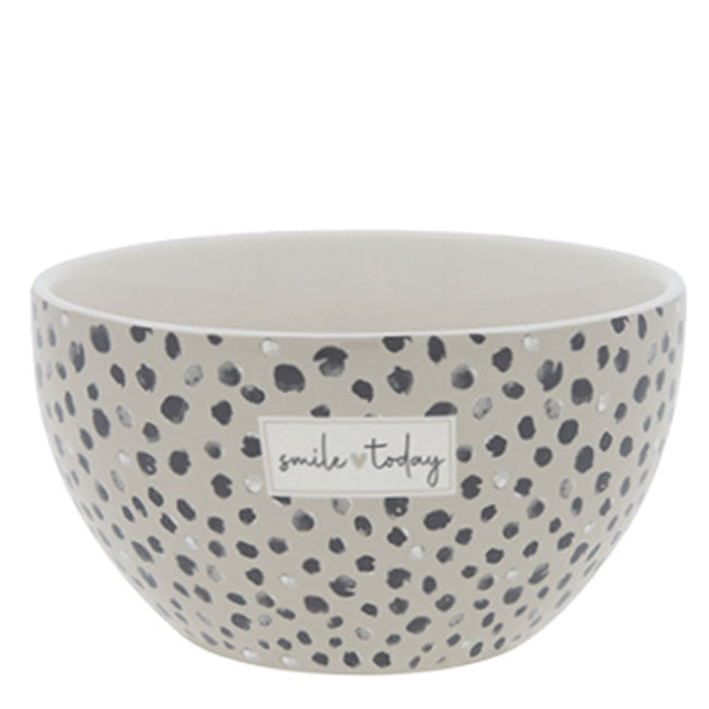 A Bastion Collections – Schüssel Konfetti Smile Today Titane mit einem schwarz-weißen Tupfenmuster.