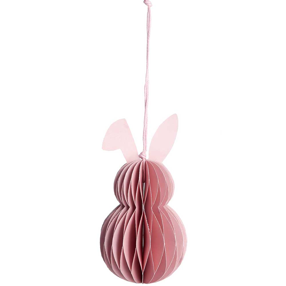 Eine Storefactory - Hilma Anhänger Osterhase Rosafarbenes Ornament aus Papier, das an einer Schnur hängt.